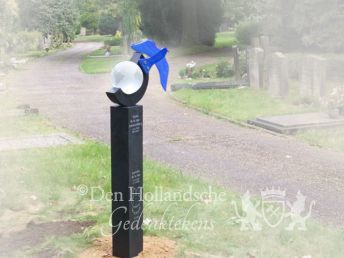 Grafmonument met wereldbol en vogel