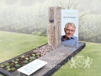 Modern glazen grafmonument met ruwe steensoorten